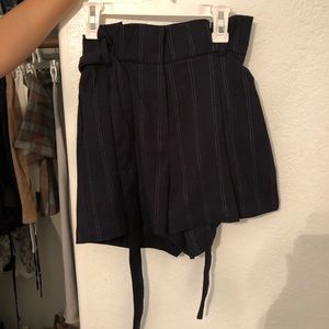 Black shorts with white stripes